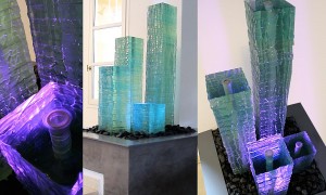 Glass column with lighting effects on a patio