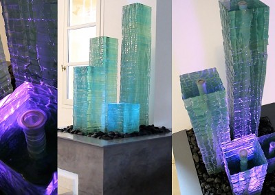 Glass column with lighting effects on a patio